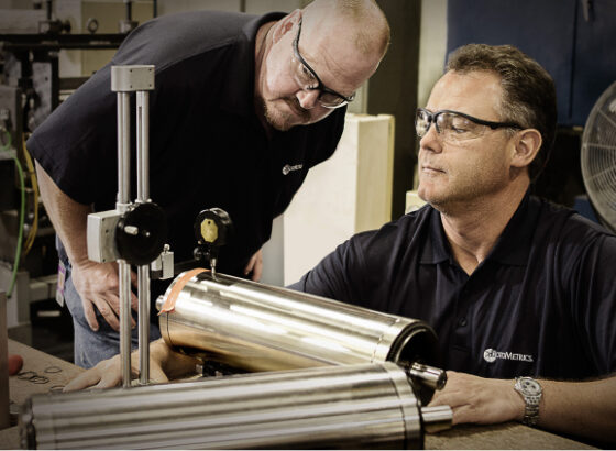 Men inspecting rotary die